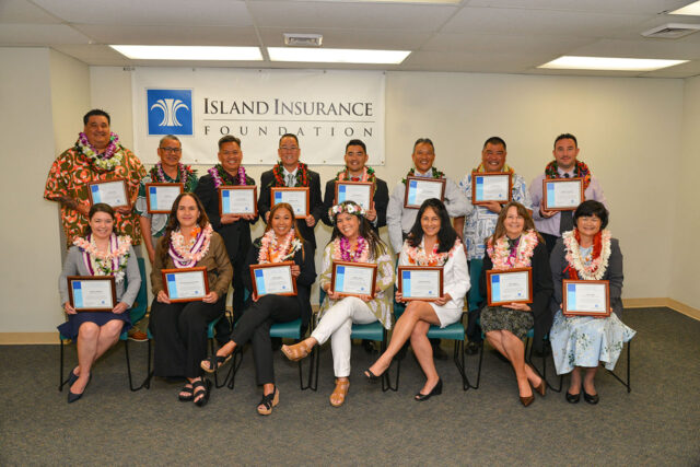 people smiling holding awards